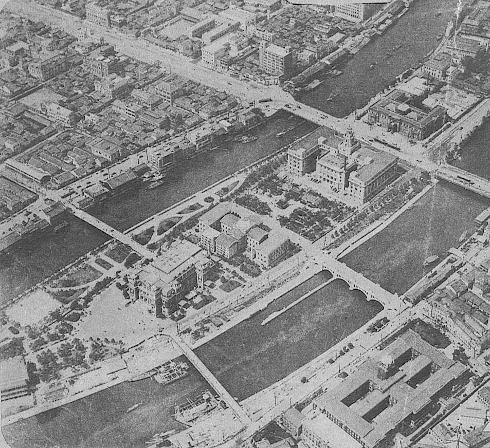 1930年の中之島。中央公会堂・市立図書館・市役所・日本銀行大阪支店と御堂筋が写る俯瞰の古写真